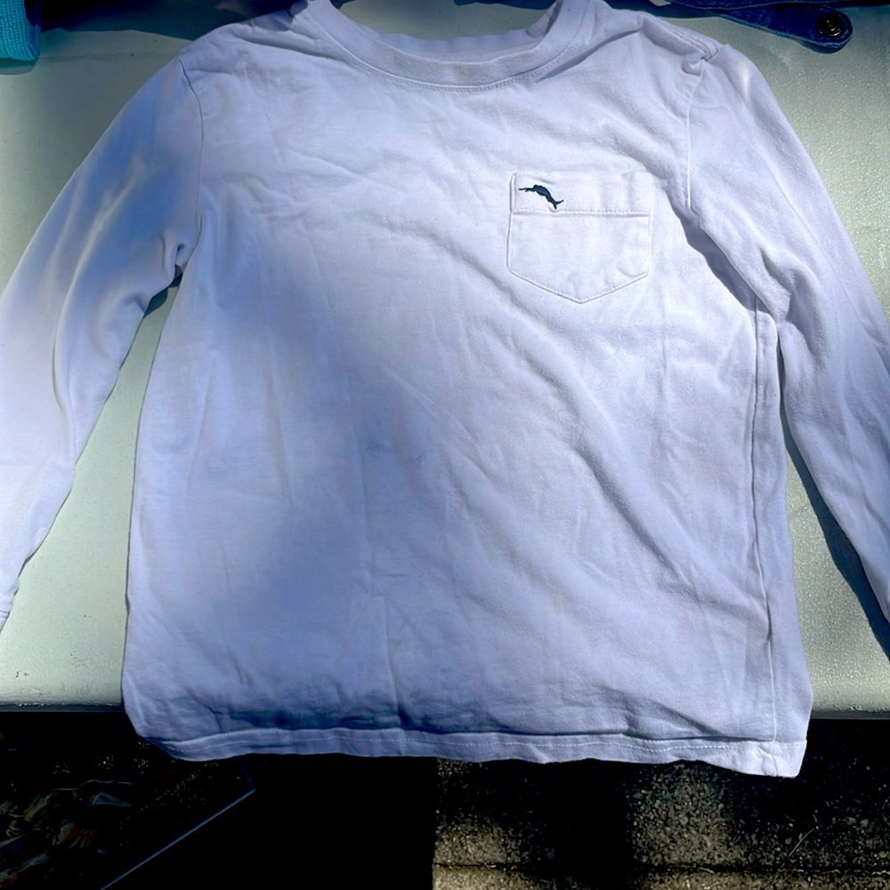 It is a white long sleeve for kids s(5/6) Tommy bahama